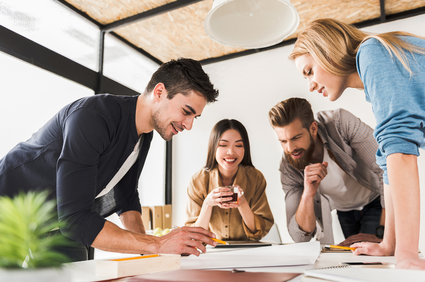 People collaborating in a modern workshop